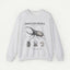 A light heather gray crewneck sweatshirt featuring a detailed black and white scientific Anatomy of a Hercules Beetle on the front, with text reading 'HERCULES BEETLE' and smaller specimen-style labels.