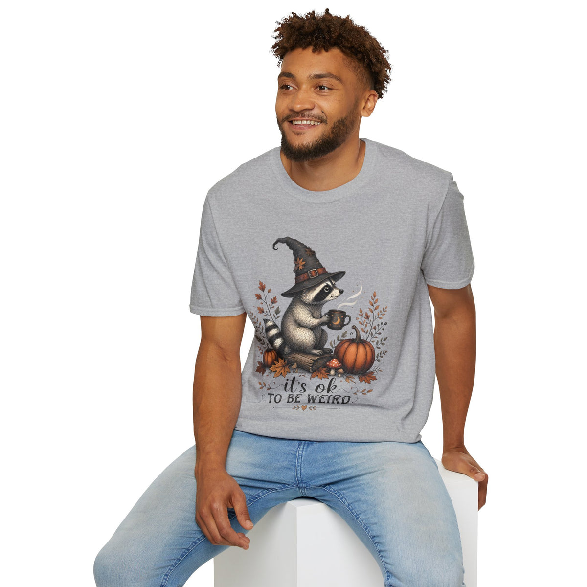 T-Shirt — Cute Raccoon Witch Illustration "It's OK to Be Weird" | Halloween Cozy Fall Graphic Tee
