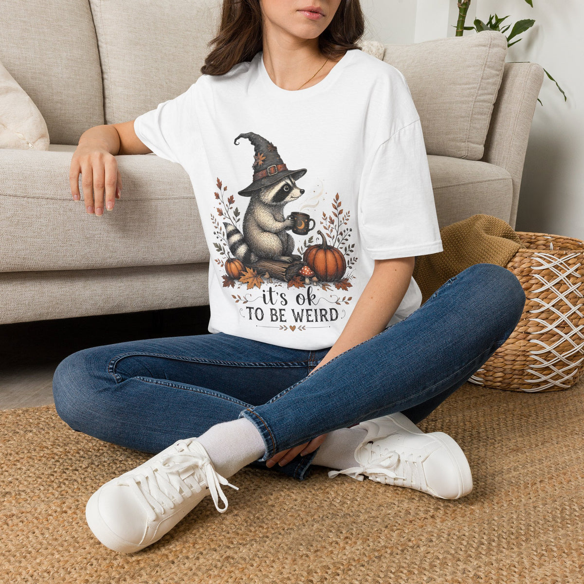 T-Shirt — Cute Raccoon Witch Illustration "It's OK to Be Weird" | Halloween Cozy Fall Graphic Tee