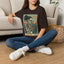 The Bird Lady T-Shirt — Retro Skeleton Woman with Parrot Graphic