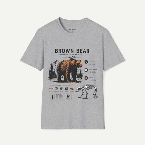 A light gray heather crewneck t-shirt featuring a detailed graphic print of a brown bear, its skeleton, and various animal illustrations with text on the front, displayed against a light off-white background.