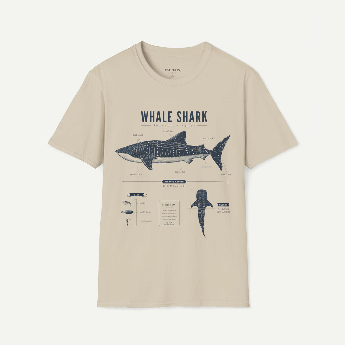 A beige short-sleeve crewneck t-shirt featuring a dark blue graphic print of a whale shark with anatomical details and text labels, displayed on a clean off-white background.