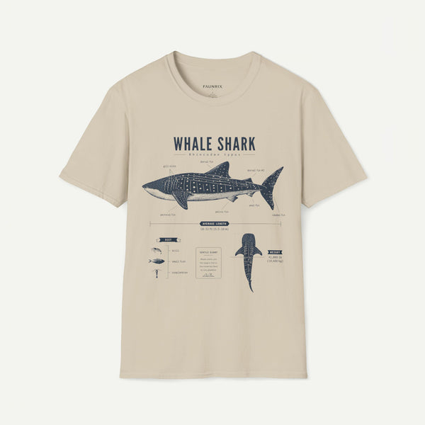 A beige short-sleeve crewneck t-shirt featuring a dark blue graphic print of a whale shark with anatomical details and text labels, displayed on a clean off-white background.