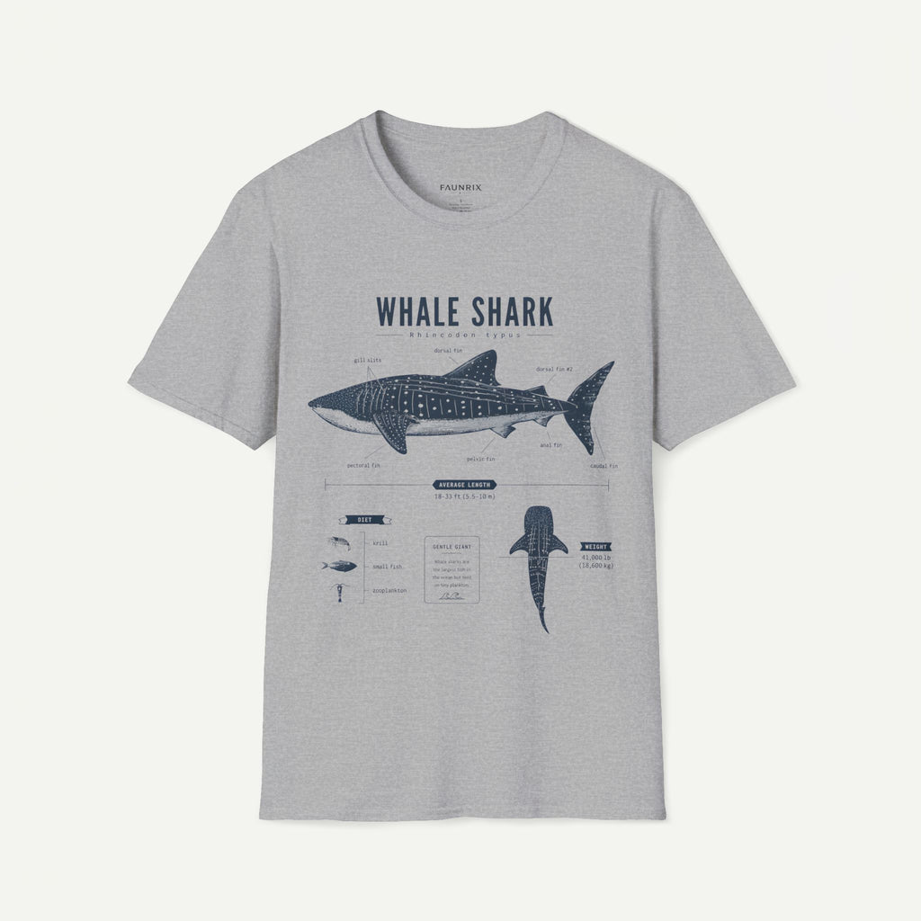 A light gray heather crewneck t-shirt featuring a dark blue-gray graphic print of a whale shark with educational text and diagrams, displayed on a clean off-white background.